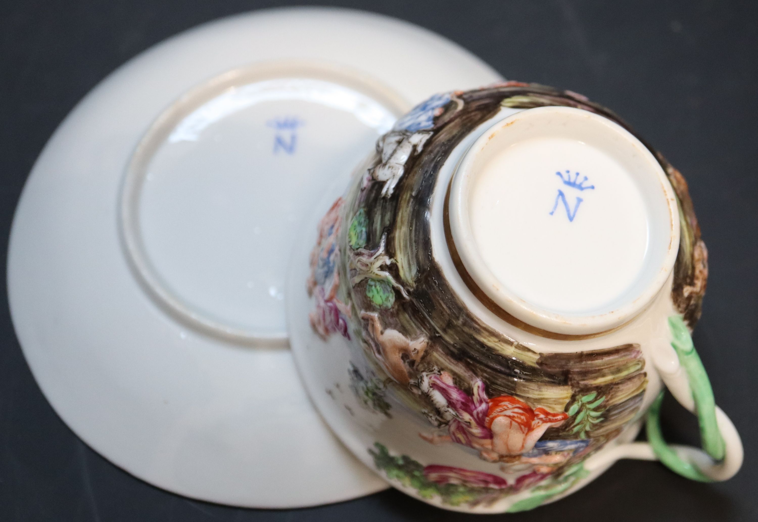 Five Continental porcelain cups and saucers, 19th century,